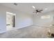 Comfortable room with carpet, a rustic stove, and a view of the updated kitchen at 3353 S Glencoe St, Denver, CO 80222