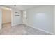 Versatile room with tile flooring, an exterior door, and access to another room at 3353 S Glencoe St, Denver, CO 80222