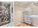 Walk-in closet offering adjustable wire shelving and a view of the shower at 3353 S Glencoe St, Denver, CO 80222
