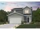 Charming two-story home with a two-car garage, neutral color palette, and welcoming front porch at 2178 Flower Blossom Ave, Brighton, CO 80601