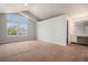 A primary bedroom featuring a vaulted ceiling, lots of natural light, and a vanity area at 5755 S Zante Cir, Aurora, CO 80015