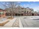 Condominium community with multiple attached garages and brick and stucco facade at 199 Quebec St # M, Denver, CO 80220