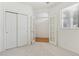 Bright bedroom featuring a window and closet space with an attached storage space at 12879 E Dickensen Pl, Aurora, CO 80014