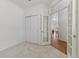 Bedroom featuring closet, glass french doors, neutral carpet and fresh paint at 12879 E Dickensen Pl, Aurora, CO 80014
