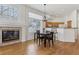 Dining area leading to the kitchen features hardwood floors, natural light, and an open design at 12879 E Dickensen Pl, Aurora, CO 80014