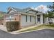 Charming home featuring a gray exterior, brick accents, and a well-kept lawn at 12879 E Dickensen Pl, Aurora, CO 80014
