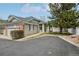 Charming townhouse with well-maintained landscaping, a front yard, and a private driveway at 12879 E Dickensen Pl, Aurora, CO 80014
