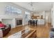 Inviting living space featuring a fireplace, dining area, and an open view to the kitchen at 12879 E Dickensen Pl, Aurora, CO 80014