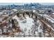 An aerial view featuring a park in a residential neighborhood with a city skyline in the distance at 2729 W 28Th Ave # 401, Denver, CO 80211