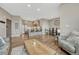 Bright open-concept living space flows into a modern kitchen with stainless steel appliances and island seating at 2729 W 28Th Ave # 401, Denver, CO 80211
