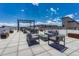An open rooftop patio with contemporary outdoor furniture, ideal for enjoying city views and socializing at 2729 W 28Th Ave # 401, Denver, CO 80211