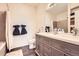 Elegant bathroom featuring a double vanity, modern fixtures, and a well-lit mirror for a luxurious experience at 5255 Memphis St # 311, Denver, CO 80239