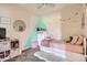 Bright bedroom featuring light walls, plush carpet, and a comfortable bed with decorative touches at 5255 Memphis St # 311, Denver, CO 80239