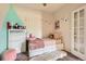 This bedroom features light walls, plush carpet, comfortable bed, and modern furniture at 5255 Memphis St # 311, Denver, CO 80239