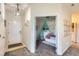 Inviting entryway leads to a charming bedroom with a unique wall design and playful decor at 5255 Memphis St # 311, Denver, CO 80239