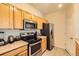 Well-equipped kitchen featuring stainless steel appliances, ample cabinet space, and a functional layout at 5255 Memphis St # 311, Denver, CO 80239