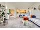 Open concept living room with view into bedroom on a bright sunny day at 5255 Memphis St # 311, Denver, CO 80239