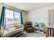 Cozy Bedroom with a crib, and a chair at 1075 Spartan Ave, Berthoud, CO 80513