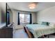 Bright bedroom with carpet, large window, and modern furnishings at 1075 Spartan Ave, Berthoud, CO 80513