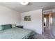 Clean bedroom with minimalist decor, neutral walls, and carpet at 1075 Spartan Ave, Berthoud, CO 80513