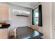 Dining area featuring stylish table and chairs, a large window, and modern decor at 1075 Spartan Ave, Berthoud, CO 80513