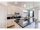 Modern kitchen with stainless steel appliances and granite countertops at 1075 Spartan Ave, Berthoud, CO 80513