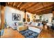 Cozy living room features a large sectional couch, hardwood floors, and modern decor at 2955 Inca St # 2L, Denver, CO 80202