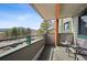 Inviting balcony with seating offering scenic views of the surrounding landscape and mountains at 31819 Rocky Village Dr # 208, Evergreen, CO 80439