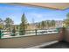 Relaxing balcony with picturesque views of the distant mountains and lush forest at 31819 Rocky Village Dr # 208, Evergreen, CO 80439