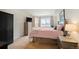 Bright bedroom with a large window offering mountain views, featuring a comfortable bed and furniture at 31819 Rocky Village Dr # 208, Evergreen, CO 80439