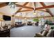 Clubhouse featuring a vaulted ceiling, creating a spacious and inviting atmosphere for gatherings and events at 31819 Rocky Village Dr # 208, Evergreen, CO 80439