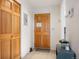 Entryway showcasing wood door, wardrobe, and modern decor creating a welcoming and organized space at 31819 Rocky Village Dr # 208, Evergreen, CO 80439