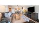 Open-concept living space with dining area and modern furniture at 31819 Rocky Village Dr # 208, Evergreen, CO 80439