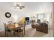 Cozy living area with a fireplace, dining table, and comfortable seating at 31819 Rocky Village Dr # 208, Evergreen, CO 80439