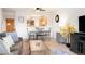 Living room open to dining area with stylish decor at 31819 Rocky Village Dr # 208, Evergreen, CO 80439