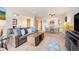 Spacious living room connected to dining and kitchen areas at 31819 Rocky Village Dr # 208, Evergreen, CO 80439