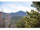 Scenic view of the mountains, offering a picturesque backdrop and highlighting the natural beauty of the property at 31819 Rocky Village Dr # 208, Evergreen, CO 80439
