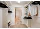 Spacious walk-in closet with shelving and racks, leading to a Primary bathroom with a soaking tub at 31819 Rocky Village Dr # 208, Evergreen, CO 80439