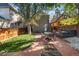 Inviting backyard with brick patio, lush lawn, string lights, and comfortable outdoor seating, perfect for relaxing and entertaining at 1333 N Lafayette St, Denver, CO 80218