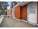 Private balcony featuring a red brick exterior and white railing at 1333 N Lafayette St, Denver, CO 80218