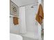 Contemporary bathroom has a walk-in shower, a stylish towel rack and a neutral color palette at 1333 N Lafayette St, Denver, CO 80218