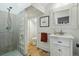 Bright bathroom featuring a glass shower, stylish vanity, and modern fixtures at 1333 N Lafayette St, Denver, CO 80218