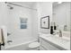 Bright bathroom featuring a shower-tub combination, subway tile, and modern fixtures at 1333 N Lafayette St, Denver, CO 80218