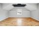 Bright bedroom featuring hardwood floors, a window, and geometric ceiling detail at 1333 N Lafayette St, Denver, CO 80218