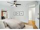 Comfortable bedroom with hardwood floors and a view of the bathroom and closet space at 1333 N Lafayette St, Denver, CO 80218