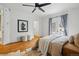 Bedroom features hardwood floors, French doors and contemporary artwork at 1333 N Lafayette St, Denver, CO 80218