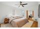 Well-lit bedroom featuring hardwood floors, neutral colors, and a ceiling fan at 1333 N Lafayette St, Denver, CO 80218
