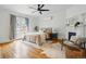 Large bedroom with hardwood floors, a decorative fireplace, French doors and an overhead fan at 1333 N Lafayette St, Denver, CO 80218