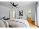 Bedroom showcasing hardwood floors and access to additional rooms in the house at 1333 N Lafayette St, Denver, CO 80218