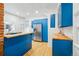 Bright kitchen featuring modern blue cabinets, stainless steel appliances, and butcher block countertops at 1333 N Lafayette St, Denver, CO 80218